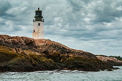 Moose Peak Lighthouse Along Rocky Island Shore